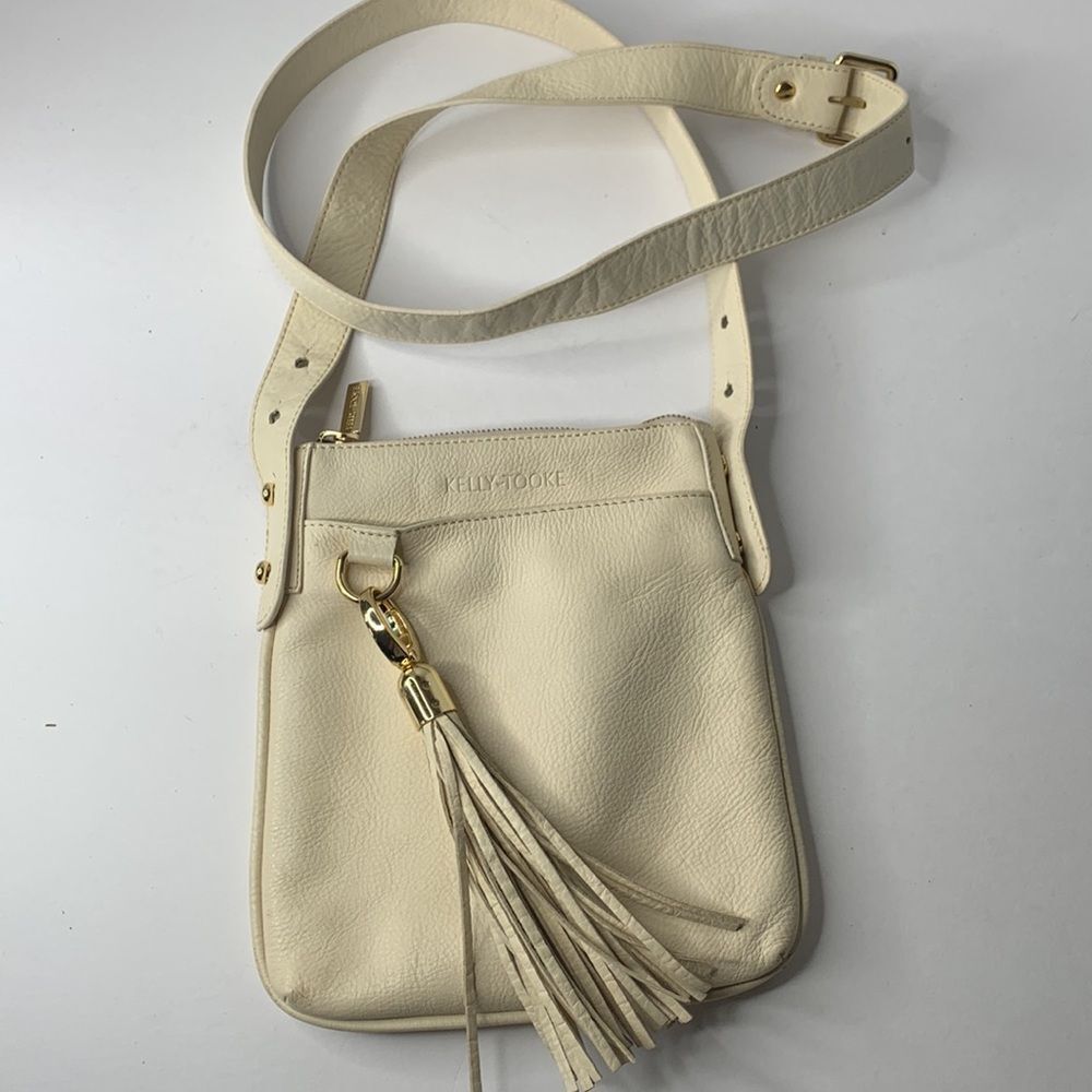 Kelly Tooke cream leather tasseled charm keychain crossbody bag